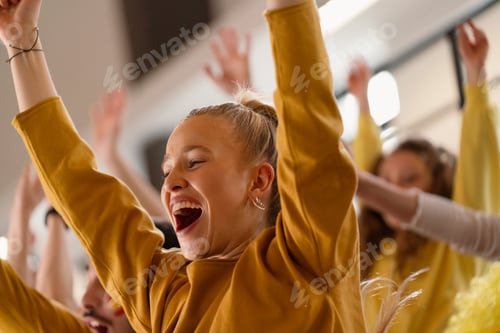 Preview: Spanish football fans celebrating their team's victory at stadium.