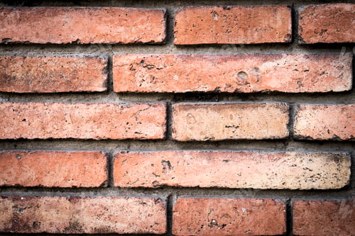 Red Brick Wall Background with Mortar Close-up
