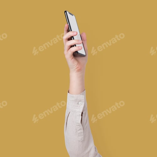 Preview: Blank smartphone screen isolated in studio with hand raised
