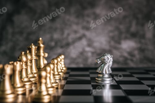 Preview: Gold and Silver Chess on chess board game for business metaphor leadership concept