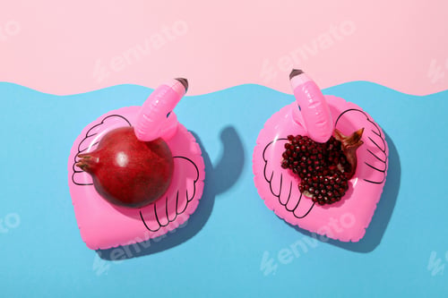 Preview: Fresh juicy pomegranate on a blue background