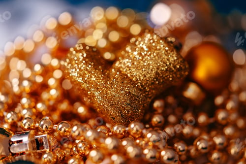 Preview: Christmas golden decorations with bokeh light close up .