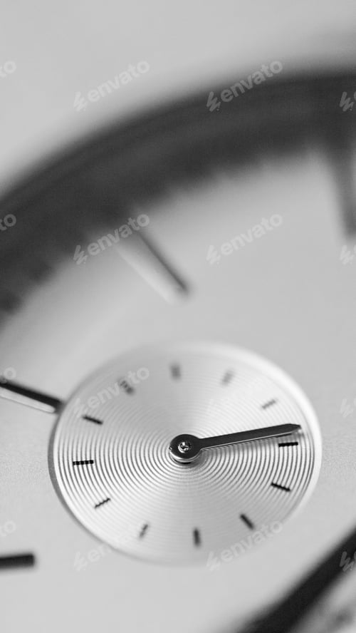Preview: Vertical grayscale shot of details on a luxurious silver watch