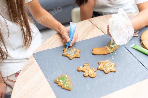 Preview: Cooking Christmas gingerbread. Child decorating cookies. Festive homemade decorated sweets