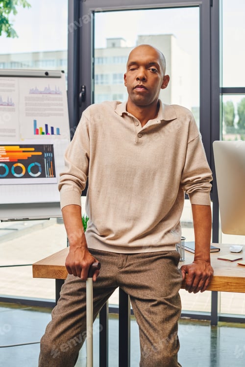 Preview: inclusion, myasthenia gravis syndrome, bold african american businessman standing with walking cane