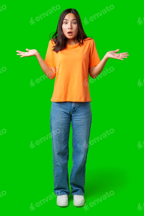 Preview: Young woman in orange shirt expresses confusion against a bright green background
