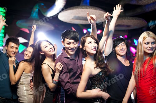 Preview: Stylish young people dancing in nightclub