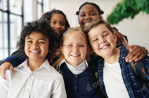 Preview: Shot of a diverse group of children standing together in the hallway at school during the day