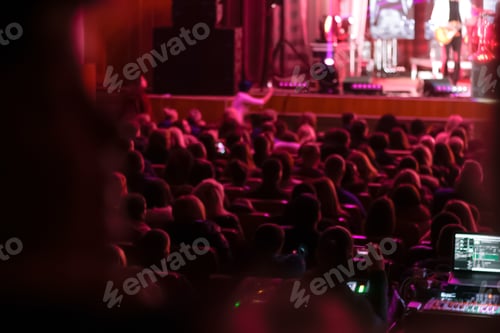 Preview: The audience sits in the hall, engrossed in the concert. Spectators in the auditorium captivated by