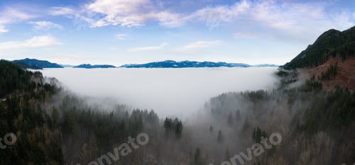 Preview: Aerial Panoramic View of Canadian Mountain Landscape covered in fog over Harrison Lake