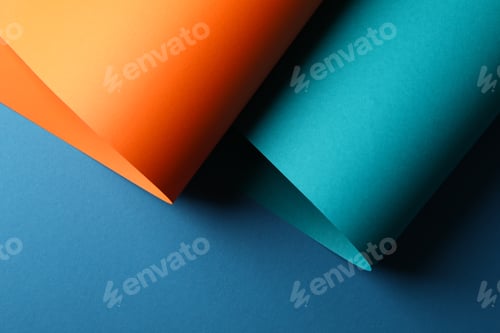 Preview: Color sheets on blue background, close up. Abstract background