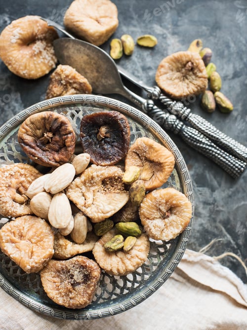 Preview: Dried figs and nuts served on antique plate, close-up