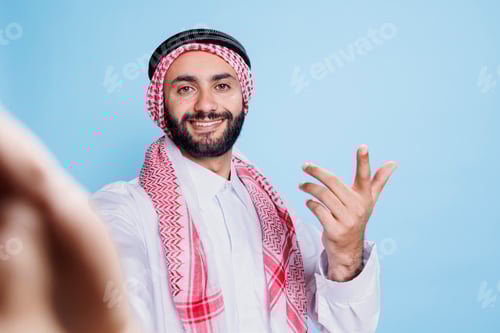 Preview: Muslim man engaging in video call