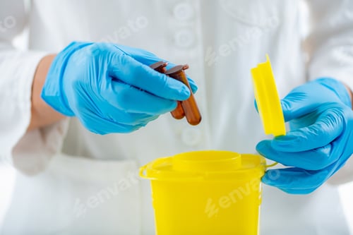 Preview: Medical Waste. Throwing Away Laboratory Consumables in Container for Hazardous Medical Waste.