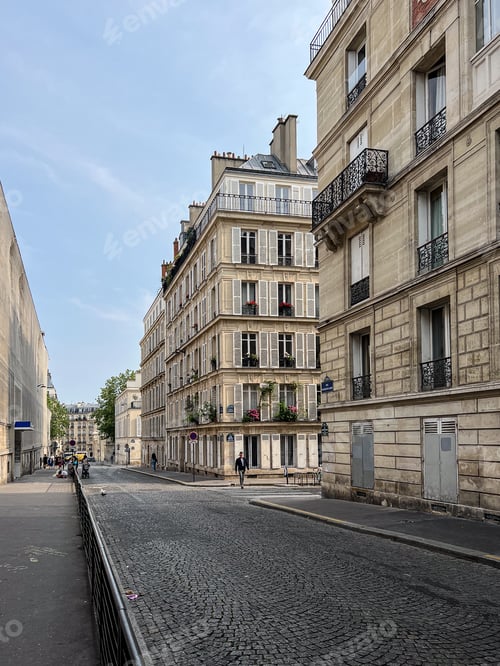 Preview: Facades of houses in Paris with balconies and shutters