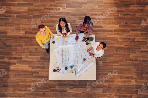Preview: Diverse group of engineers or architects having a meeting in an office