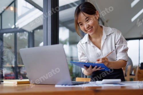 Preview: Businesswoman analyzing investment charts with calculator laptop. Accounting and technology in the o