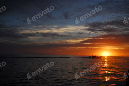 Preview: Dramatic sky and sunrise over ocean at dawn, Magdalena Bay, Baja California, Mexico