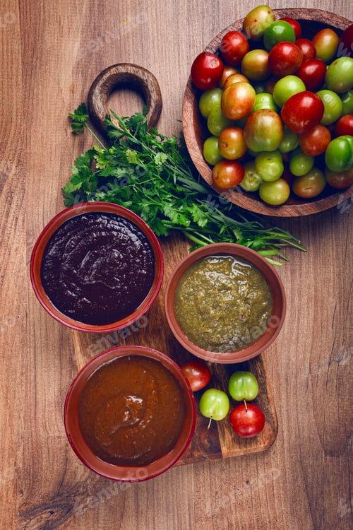Preview: set of tkemali sauces, three types of tkemali sauce, in ceramic bowls, top view, Georgian cuisine,