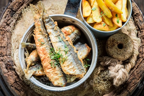 Preview: Delicious herring fish and chips with herbs and salt