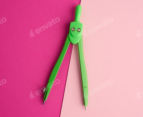 Preview: Green school compass on a pink background