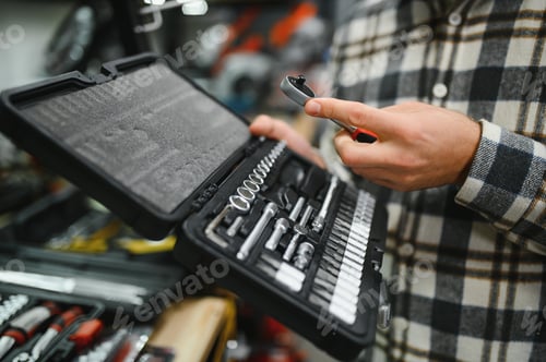 Preview: the buyer of the hypermarket of tools and finishing goods chooses an open-end wrench
