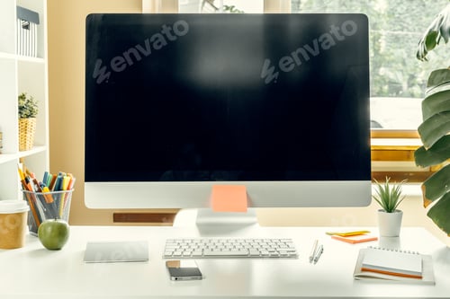 Preview: Office or home workspace. Computer monitor with black screen on office table with supplies