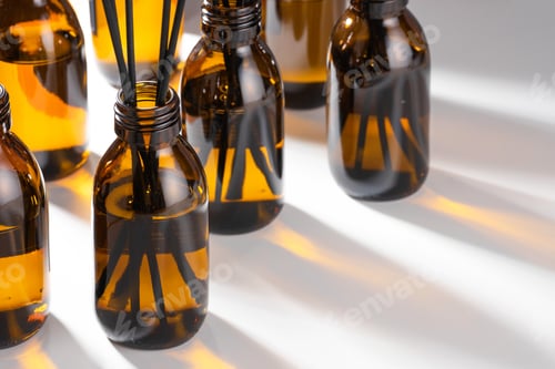 Preview: Aroma diffuser with essential oil in a Amber, brown glass bottle. Creative trendy image