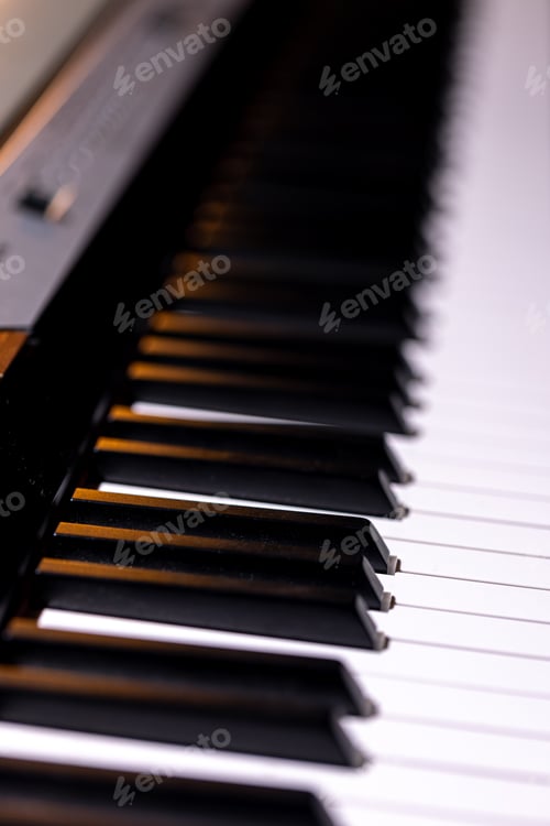 Preview: Close-up of an electronic piano keyboard, soft focus.