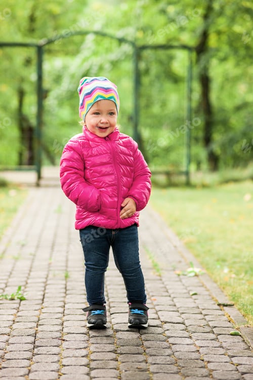 Preview: The Little Baby Girl Standing At Park