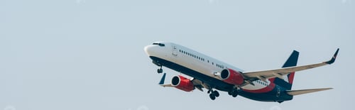 Preview: Flight departure of airplane with blue sky at background, panoramic shot
