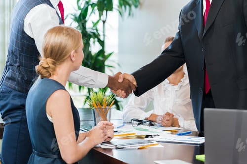 Preview: Business meeting in office with handshake and team collaboration in bright workspace