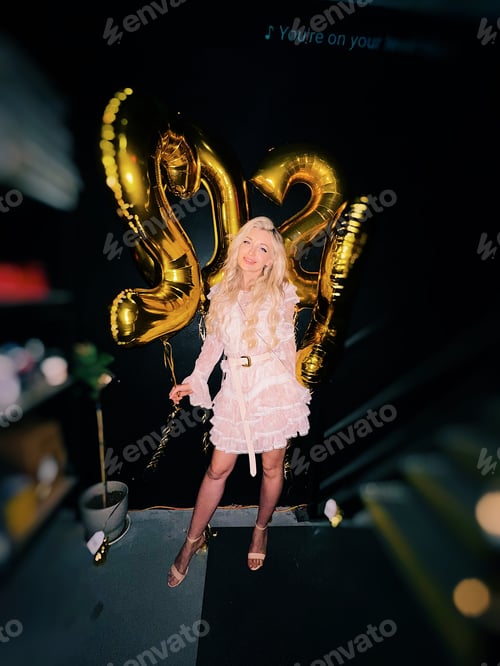 Preview: Beautiful blonde girl celebrating New Year 2022