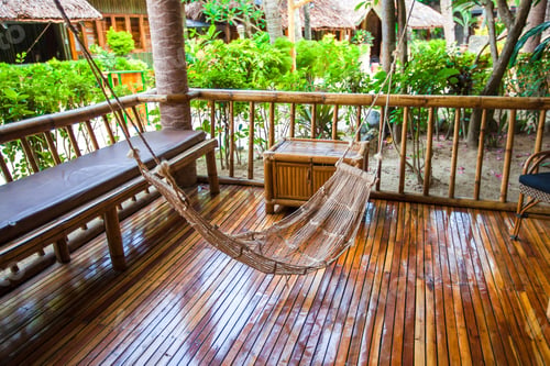 Preview: Hammock on terrace of cozy room in hotel in summer day