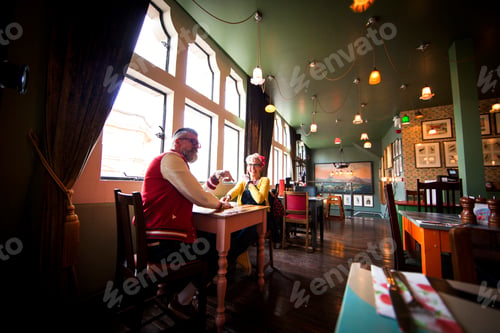 Preview: Quirky couple relaxing in bar and restaurant, Bournemouth, England