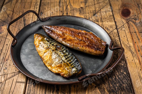 Preview: Baked Grilled mackerel fillets. Wooden background. Top view