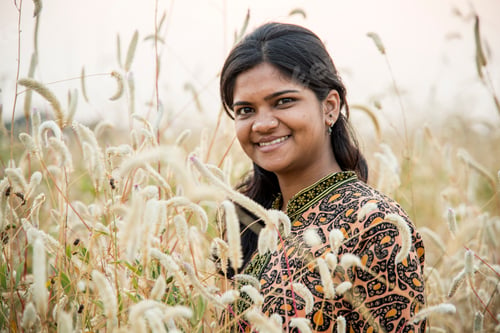 Preview: Smiling woman farmer in agricultural field