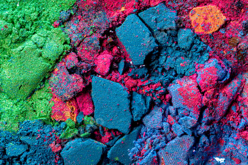Preview: Background of scattered crashed eye shadows of different colors