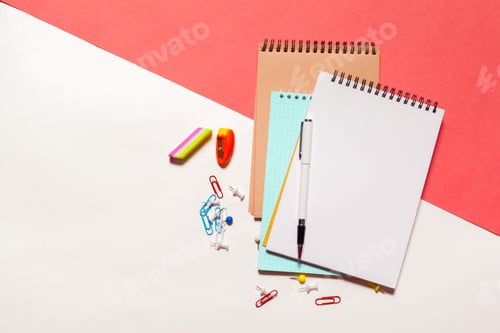 Preview: Colorful stationery items arranged on a desk with notebooks and office supplies
