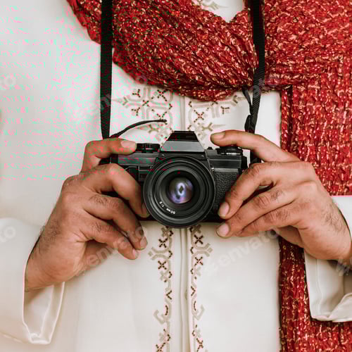 Preview: Indian man in a kurta with a digital camera