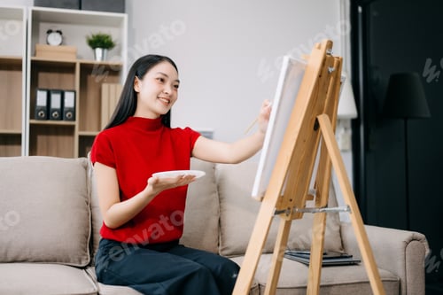 Preview: Asian Female painter do artwork in art workshop, painting supplies, oil pastels