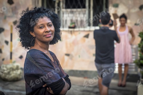 Preview: Portrait of fashion shoot assistant smiling and looking at camera