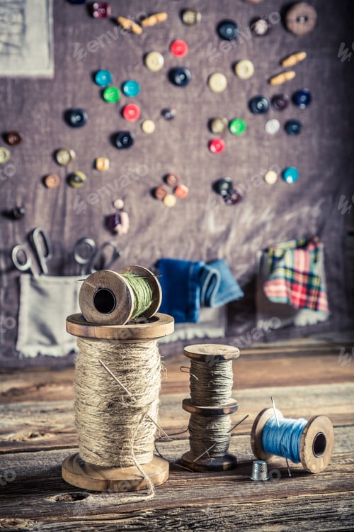 Preview: Sewing mat with scissors, threads and needles in tailor workshop