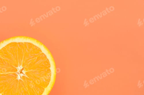 Preview: Top view of a one orange fruit slice on bright background in orange color