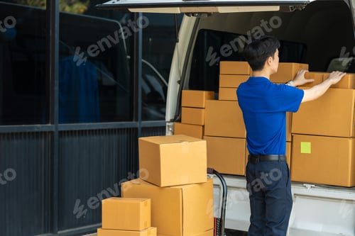Preview: Asian delivery man work in truck for checking the product in the truck, concept ecommerce.