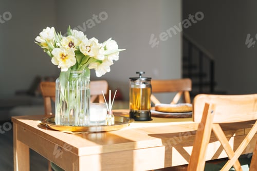 Preview: Flowers, Tea, and Cake on a Wooden Table