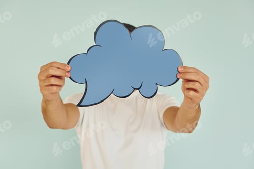 Preview: Cloud looking signs. Man standing in the studio