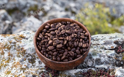 Preview: Coffee beans into ceramic bowl.