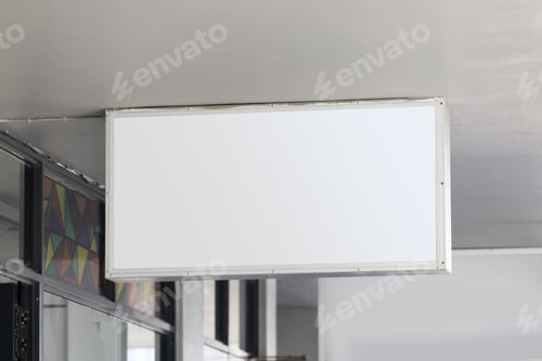 Preview: Blank sign hanging from building ceiling with copy space
