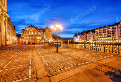 Preview: Beautiful historic city center of Lucerne with famous buildings during night..